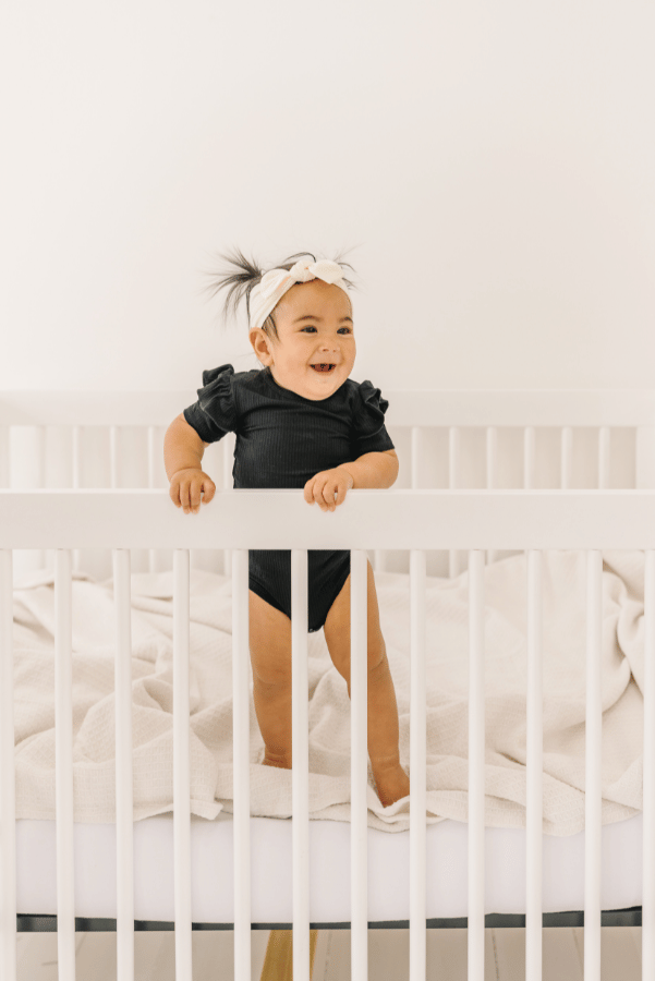 Luna Luz Black Bamboo Ruffle Sleeve Onesie In Play