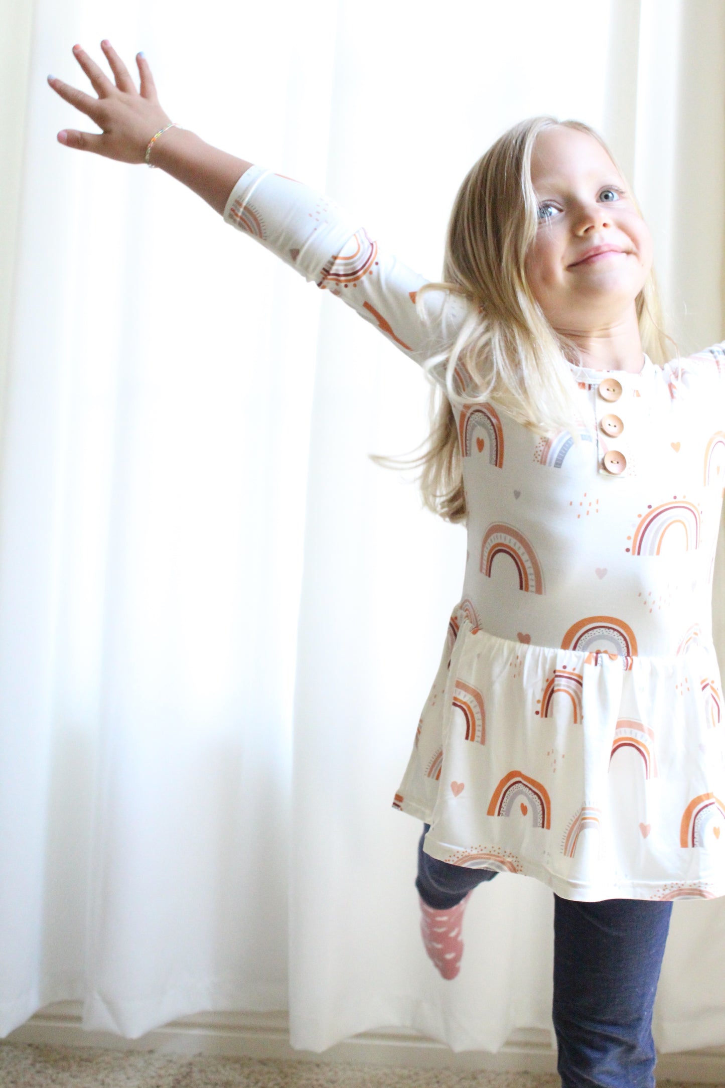Girl Wearing Luna Luz Rainbow Peplum Top