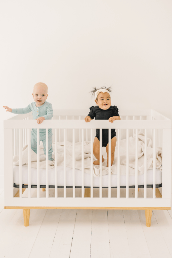 Luna Luz Black Bamboo Ruffle Sleeve Onesie In Play