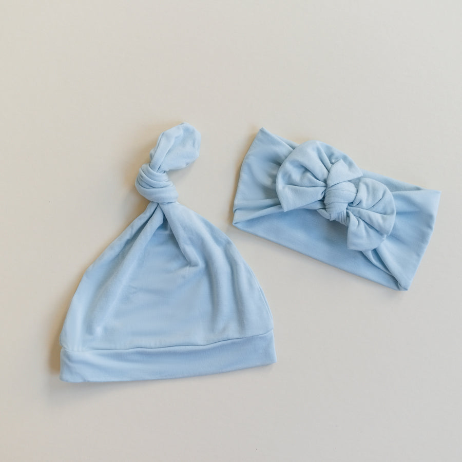 Luna Luz Bow Headband for Baby in Sky Blue Pictured With Knotted Hat in Sky Blue