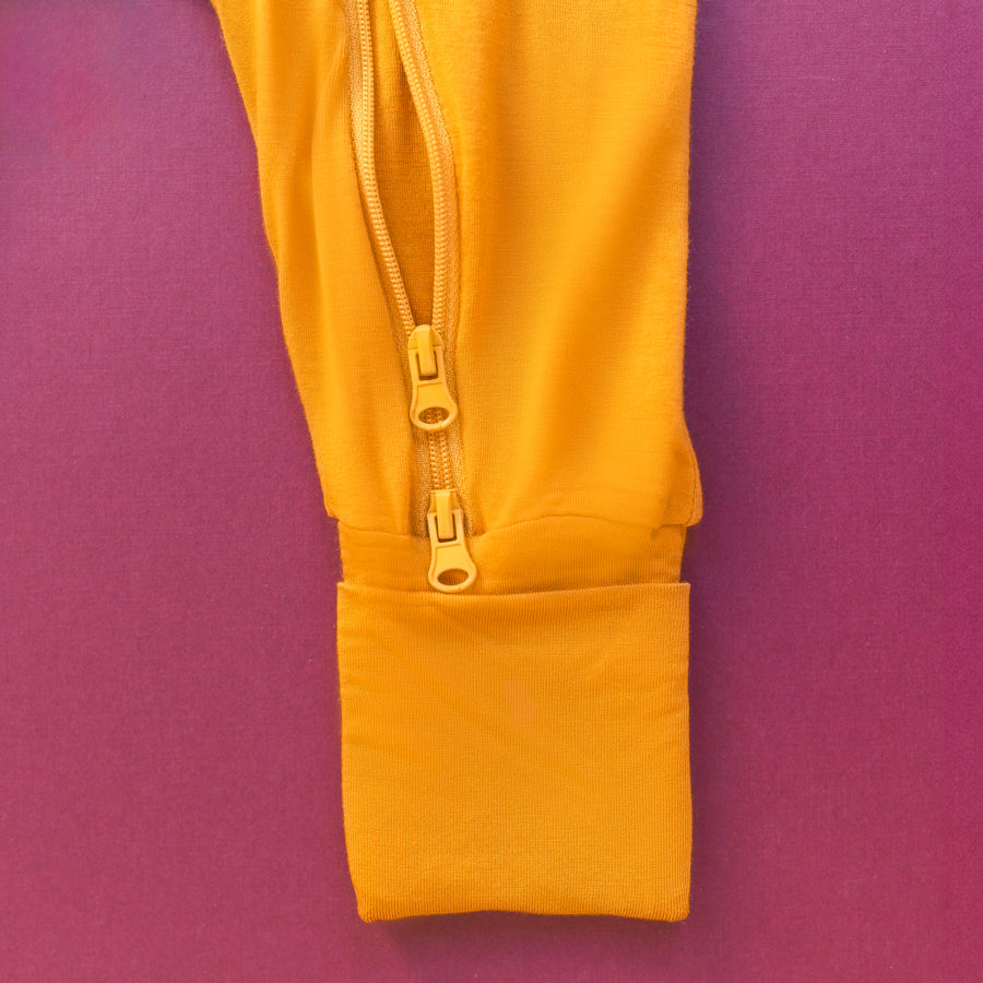 Luna Luz Two-Way Zip Romper Pajama in Mustard With Double Zip and Fold-Over Mittens at Ankles